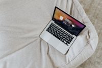 Kaboompics - Minimal Laptop Workspace on Sofa with Neutral Interior Background