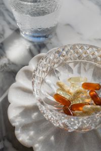 Kaboompics - Vitamins in a Crystal Bowl on a White Decorative Plate