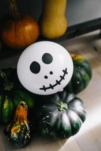 Kaboompics - Halloween Pumpkin Still Life with Skeleton and Ghost Balloons