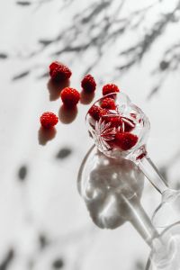 Kaboompics - Close Up Tipped Glass With Raspberries