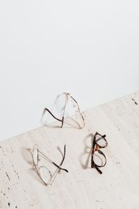 Kaboompics - Three Pairs of Eyeglasses on Pale Stone for Reading, Study and Education Editorials