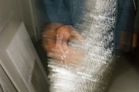 Kaboompics - Hard Flash Photography of Woman in Motion Wearing Blue Shirt and Silver Skirt