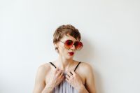 Kaboompics - Short-Haired Woman in Red Sunglasses with White Copy Space