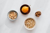 Kaboompics - Overhead Snack Spread of Cashews, Walnuts and Passion Fruit for Healthy Food Editorials