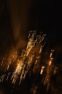 Kaboompics - Abstract Golden Light Trails on a Dark Background