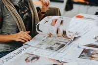 Kaboompics - Designer Reviewing Magazine Pages during Creative Workshop