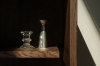 Kaboompics - Minimalist Dark Wood Shelf Decor with Glass and Silver Objects