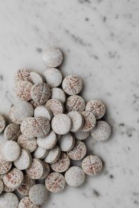 Kaboompics - Pile of Speckled Scored Tablets on Marble