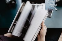 Kaboompics - Motion Blur of Person Turning Magazine Pages