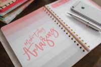 Kaboompics - Pink Spiral Planner with Let Today Be Amazing Lettering, Silver Pen and Smartphone