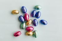 Kaboompics - Central Cluster of Colorful Foil Easter Eggs on White