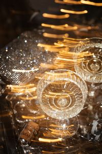 Kaboompics - Champagne Coupe Glasses with Golden Light Trails and Silver Bokeh