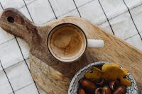 Kaboompics - Top View of Coffee and Acorn Bowl on a Wooden Board