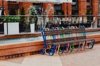 Kaboompics - Colorful Metal Bench by a Fountain and Restaurant Terrace at Manufaktura, Łódź, Poland