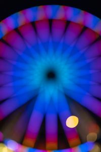 Kaboompics - Blue Violet Ferris Wheel Close-Up with Amber Bokeh