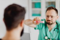 Kaboompics - Doctor Explaining Medical Ointment to Patient