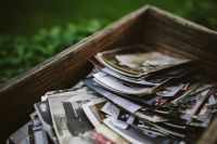 Kaboompics - Close-Up of Old Photographs Stacked in a Wooden Box