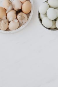 Kaboompics - Easter flat lay with green eggs on a white marble