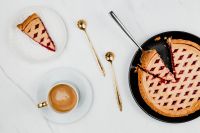 Kaboompics - Overhead Blueberry Pie with Served Slice and Cappuccino on Marble