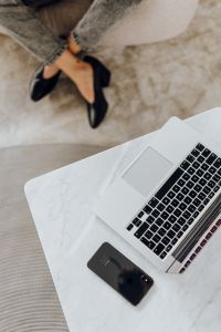 Kaboompics - Overhead Gray Jeans and Black Heels Beside Laptop, Modern Workwear Flat Lay for Style Content
