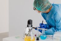Kaboompics - Female Chemist Writing Classroom Experiment Notes