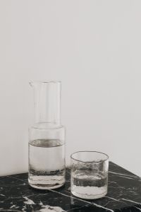 Kaboompics - Close-Up of Glass Carafe and Water Glass on Black Marble