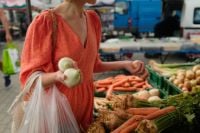 Kaboompics - Woman Carrying Fresh Onions and Vegetables