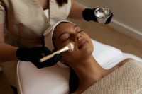 Kaboompics - Skincare Professional Applying a Facial Mask with Brush