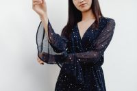 Kaboompics - Cropped Fashion Portrait of Woman in Navy Blue Dress with Flared Sleeves