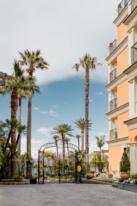 Kaboompics - Grand Hotel Royal Entrance Gate Framed By Palm Trees
