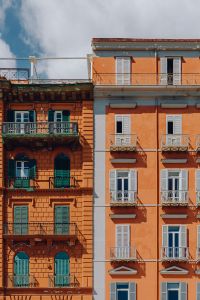 Kaboompics - Contrasting Coral and Peach Apartment Facades in Naples