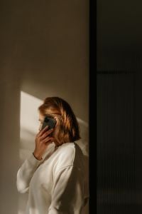 Kaboompics - Woman Taking a Phone Call in Home Office