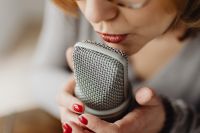 Kaboompics - Close-Up Lips Whispering into a Silver Microphone for ASMR Voice Sounds