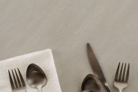 Kaboompics - Minimal Table Setting with Silver Cutlery, Napkin and Copy Space