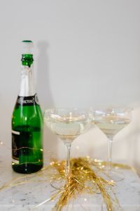 Kaboompics - Champagne Bottle and Glasses on White Console