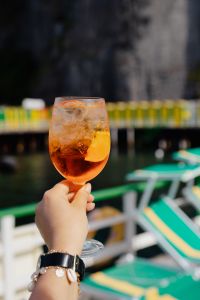 Kaboompics - Close Aperol Spritz with Blurred Seaside Railing