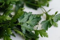 Kaboompics - Flat-Lay Close-Up of Parsley Stems and Leaves on White, Fresh Herb Texture for Food Styling