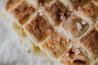 Kaboompics - Macro Detail of Coarse Salt on Scored Slovenian Bread, Artisan Baking Background