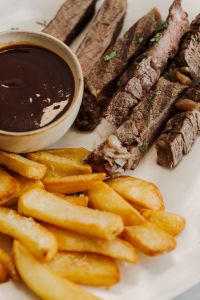 Kaboompics - Sliced Steak with Fries and Brown Sauce