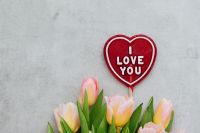 Kaboompics - I Love You Heart Sign Above a Bouquet of Pink Tulips