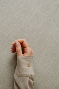 Kaboompics - Gold and Pearl Earring in Woman's Hand