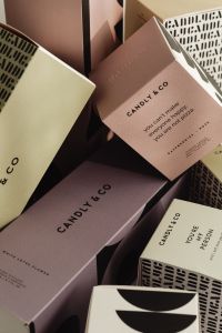 Kaboompics - Stacked Fragrance Boxes with Geometric Print Design