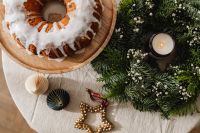 Kaboompics - Christmas Still Life with Bundt Cake, Greenery and Candle