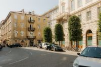 Kaboompics - Tree-Lined Trieste Street with Parked Cars and Historic Facades