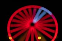 Kaboompics - Red Ferris Wheel Lights with Blue Spokes and Amber Glow