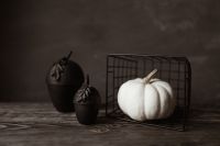 Kaboompics - White Pumpkin in Wire Basket With Black Halloween Decorations