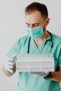 Kaboompics - Doctor Looking Down at Test Tube Rack