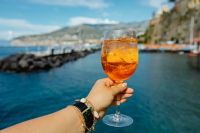 Kaboompics - Handheld Spritz beside Green Railing over Dark Water