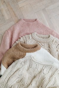 Kaboompics - Pastel Sweaters Styled on Wooden Floor