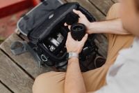 Kaboompics - Photographer holding a DSLR camera